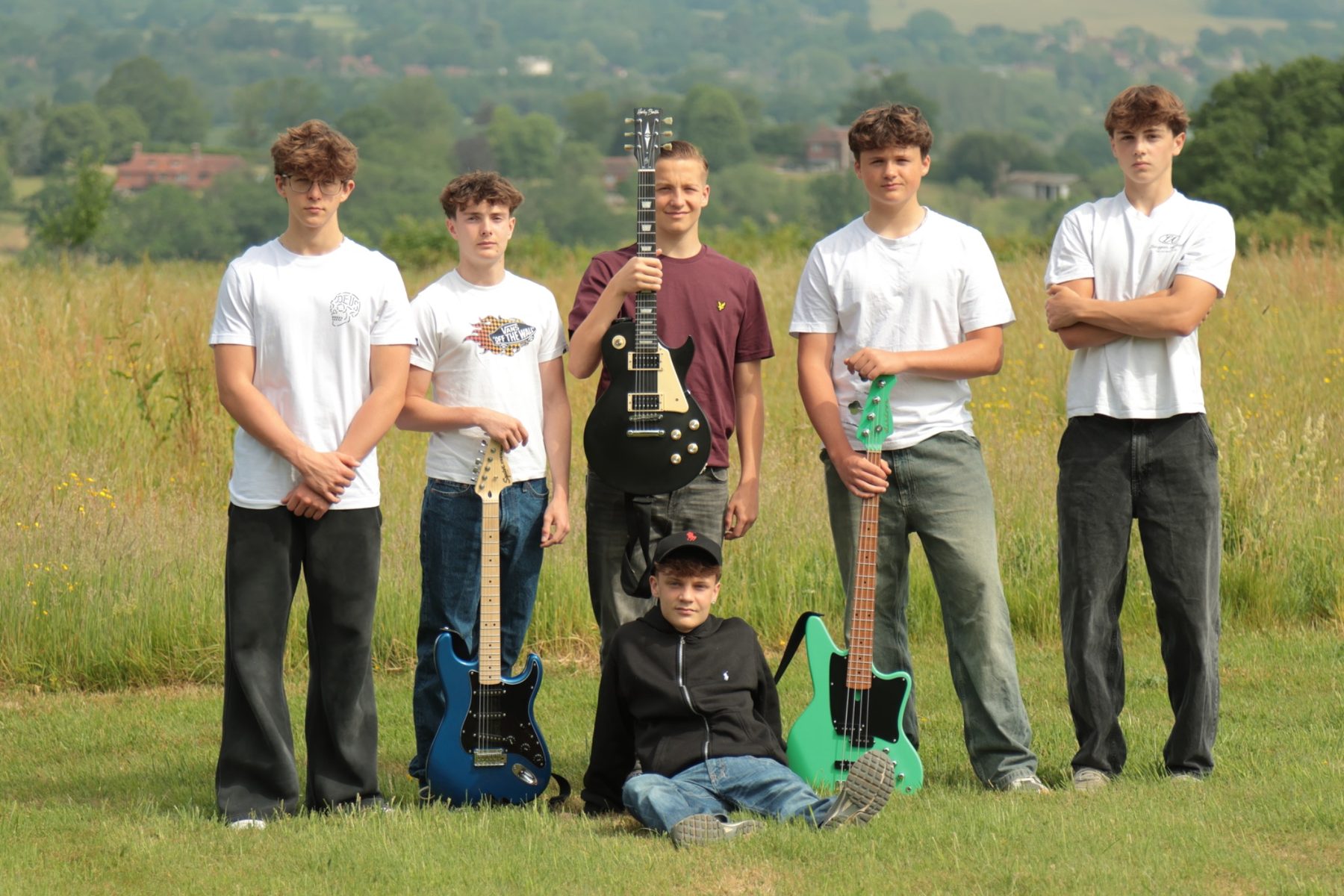 Purple Harts band portrait in a field